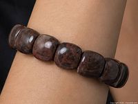 Bracelet on wrist showing bead shape and color