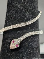 Front view showing snake head with pink stone eyes and CZ body