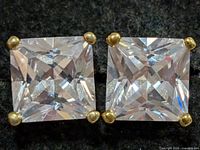 Front view showing both square CZ stones and prongs