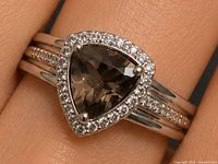Front view of ring showing smoky quartz center and CZ halo
