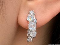 earring worn on ear showing stone arrangement