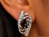 earring worn on ear showing size and design