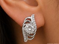 Earring worn on ear showing size and design
