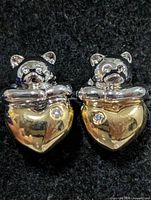 front view of both bear and heart diamond stud earrings