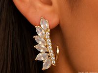 Earring worn on ear showing size and design