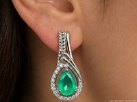 earring worn on ear showing size and drop style