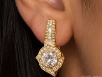 earring shown on ear for scale and design