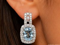 Earring worn to show size and drop style