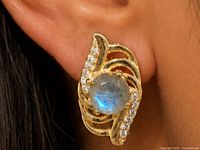 Earring worn on ear showing size and design