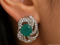 Earring worn on ear, showing size and design