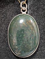 Front view of silver bezel oval ocean jasper pendant