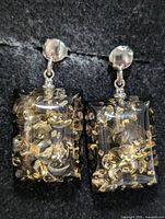 Front view of pair showing amber rectangles and silver hardware