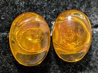 front view of both amber earrings showing cabochons