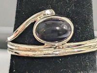 Front view showing amethyst cabochon and wrap band