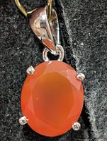 Front view of silver pendant with oval carnelian