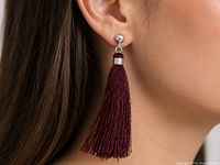 earring worn on ear showing scale and colour
