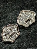 front view of both earrings showing pavé CZ and shape