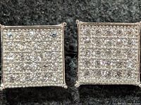 front view showing pavé CZ pattern on both earrings