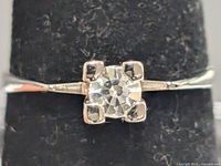 Front view of ring showing cubic zirconia and prong setting