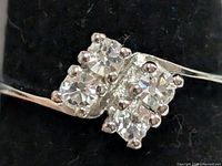 Close-up of cluster showing six prong-set CZ stones