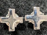front view of both silver cross stud earrings