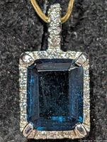 front view of pendant showing topaz and CZ halo