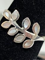 Front view showing leaf design and mother of pearl inlays