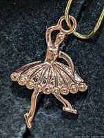 Front view of silver-tone ballerina pendant showing overall shape and detailing