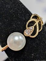 Close view of pearl and stone accent on ring