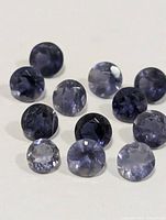 Group of 12 round faceted iolite gemstones