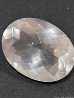 Top view of oval faceted rose quartz showing checkerboard crown