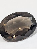 Front view of oval faceted smokey quartz