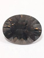 Front view of oval faceted smoky quartz showing overall colour and cut