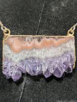Close-up of pendant showing agate banding and amethyst druzy