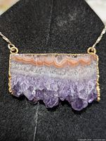 Front view of agate-quartz pendant on silver chain