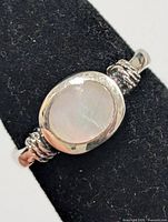 Top view showing mother of pearl cabochon and bezel