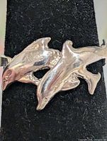 Dolphin design on sterling silver ring front view