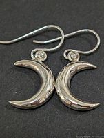 front view of both crescent moon earrings