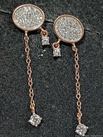 front view showing pavé discs, chain drops and CZ accents