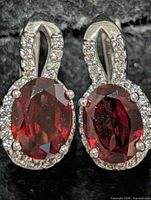 Front view showing oval garnets and CZ halo