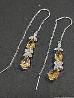 Front view of both earrings showing citrine and CZ arrangement