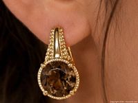 earring worn on ear showing size and style