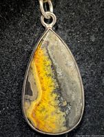 Front view of teardrop bumblebee jasper pendant