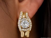 Earring worn to show size and design