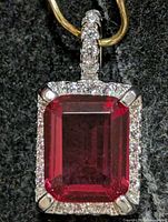 Front view showing created ruby, CZ halo and bail