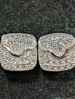 Front view of both square CZ stud earrings