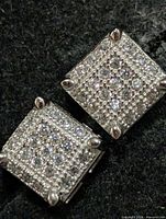Close-up of one earring front showing pavé CZ pattern