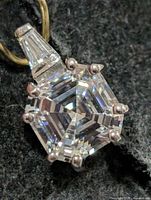 Front view of sterling silver pendant showing Asscher-cut CZ and prong setting