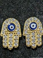 Front view of both Hamsa earrings showing evil eye centres and rhinestones