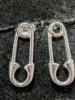 Front view of both safety pin earrings